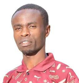 Head and shoulders portrait of Munyua Wanyoike; neutral studio background